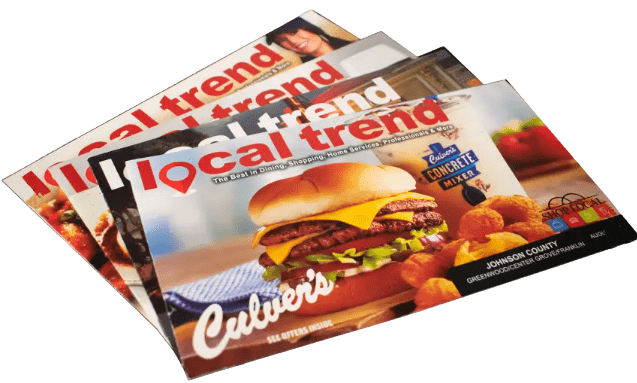 Fanned stack of Local Trend direct mail marketing booklets featuring a local business advertisements for Indiana business promotion.